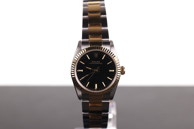Rolex Oyster Perpetual Black Dial With Gold Fluted Bezel